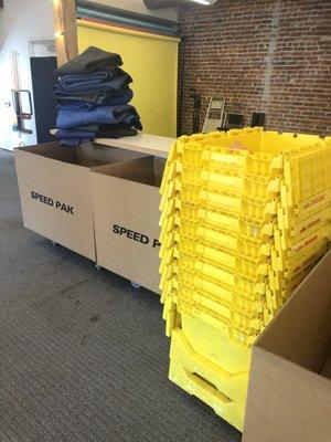 You can see the large moving boxes and yellow crates used instead of boxes.