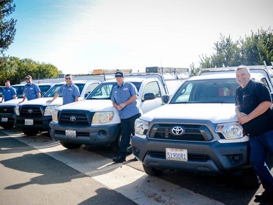 BRPINC technicians with service trucks.