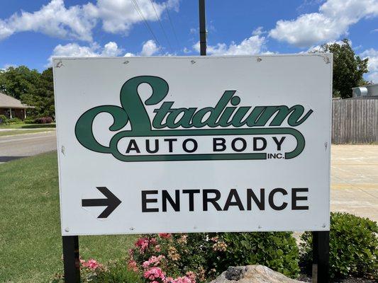 Entrance sign for Stadium Auto Body, Midtown