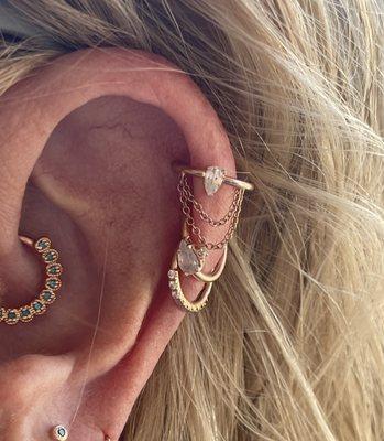 Solid 14k rose gold and genuine gems in Regina's ear