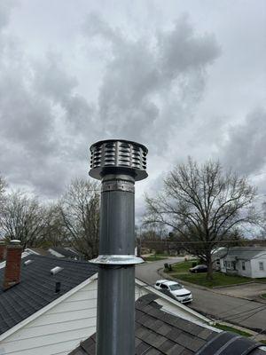 New roof installation with traditional masonry chimney removal and replacing with metal chimney pipe