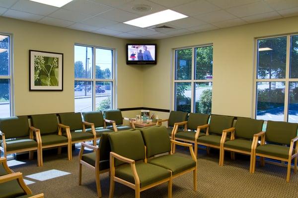 This is our waiting room with a television and coffee station.