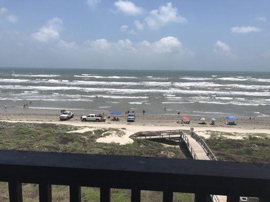 View from 5th floor balcony.  Not a fan of the trucks parked on the beach.