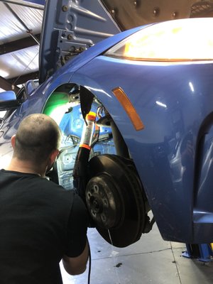 Having Justin fix my washer fluid container.