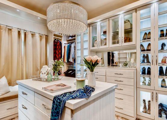 This grand master bedroom closet has designated storage for your valuables and a gorgeous island!