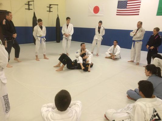 School Owner/Head Instructor Nate Ryan, Black Belt (under Roberto Maia) demonstrates an Arm Bar in the Fundamentals class M/W/F @ 6pm