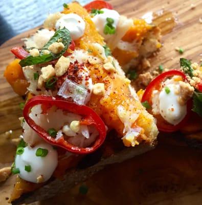 Crab and Squash Crostini: butternut squash, crab, yogurt, pickled Fresno chilies, peanut