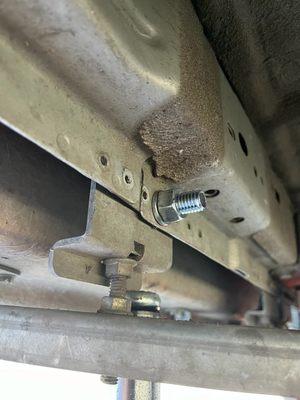 The bolt that David installed, in place of three flimsy screws, tol reattach my RV step.