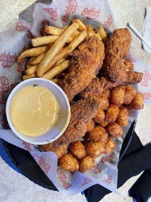 Chicken tenders potato tots and fries with honey mustard. That honey mustard was good too