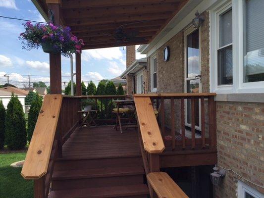 Back Porch make over, installed cedar railings custom routed edges and a two tone stain