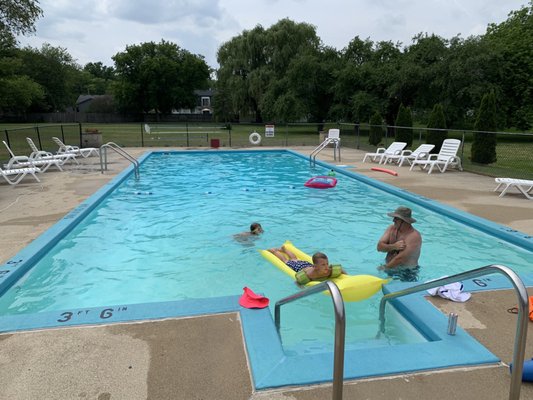 Full view of the pool. All the grass in the back is open for guest, Cornhole/bags , ladderball, or any other backyard games.