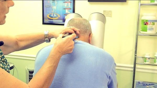 Cervical Spine adjustment Treatment at American Spinal center.