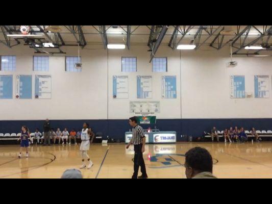 Inside The Gymnasium Of The School During A Basketball Game