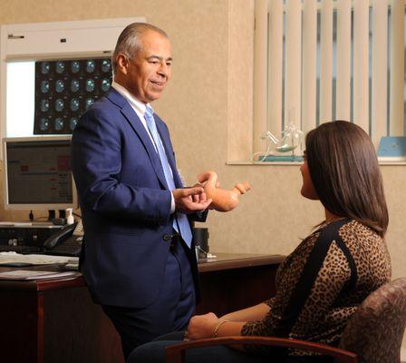 Dr. Vohra speaking with a patient.