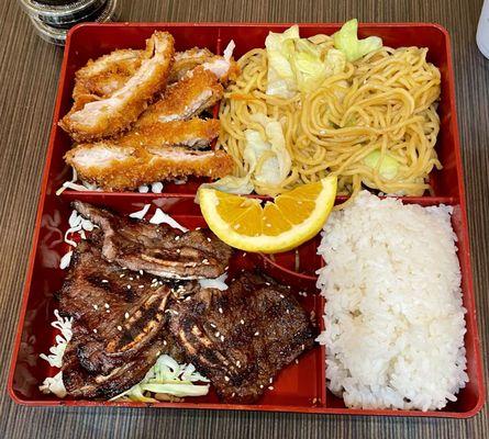 Sesame chicken, bbq short ribs, yakisoba noodles bento box