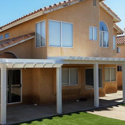 Multi level combination patio cover and family friendly EasyTurf artificial grass.