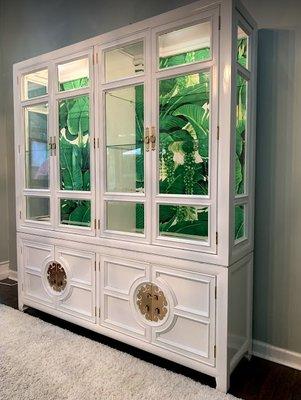 Vintage Century Furniture china cabinet in high gloss white with Dorothy Draper Brazilliance wallpaper inside