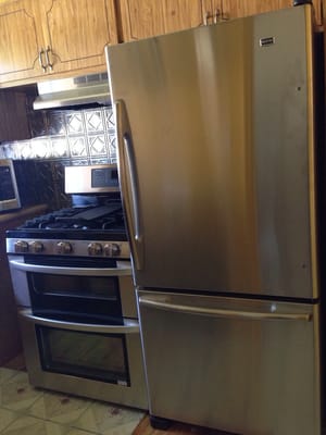 My new fridge and stove, floor tiles not done yet.