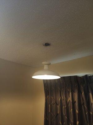 Light fixture hanging by the cord