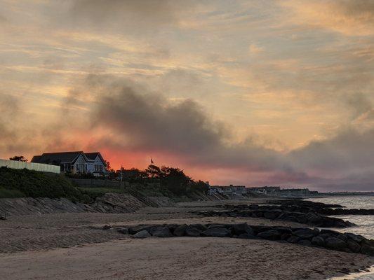 View of the sunrise from the breakers at the end of Sea Street Beach