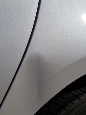 This is the dent in my car caused by the parking attendant at SP Plus parking