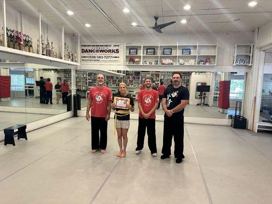 Instructors and students in class after a successful belt test!