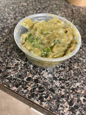 BROWN guac. I'm guessing it's from the day before smh. I got my food around 11:30am and they open at 11...