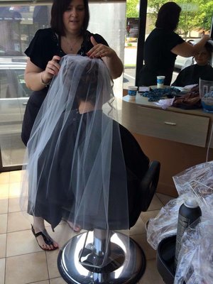 Susan styling a client for her big day!