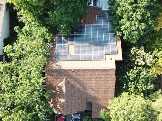 A view of our drone going to work. We frequently do arial photos to see how well solar panels are doing. Notice how shady it is?