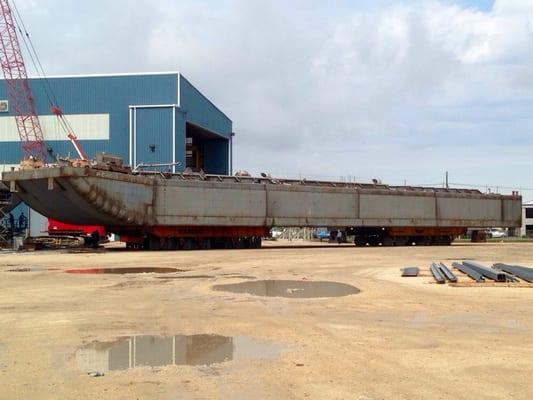 They have several large KAMAG transporters to move large barges around the yard