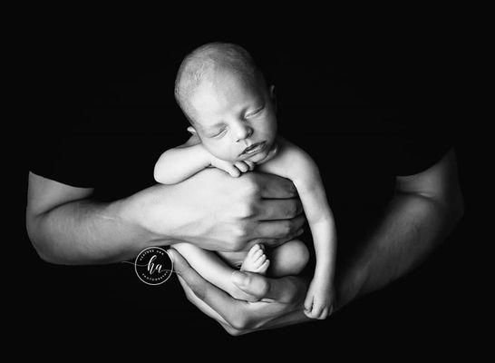 Newborn Baby in Fathers Hands - Taken in Rosemount