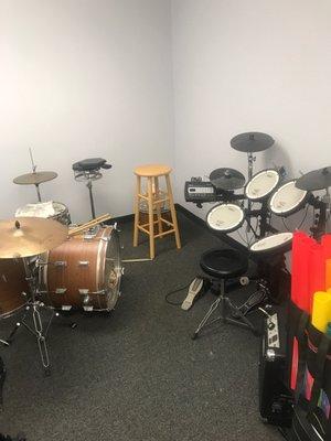 Acoustic and electric drum lesson room.