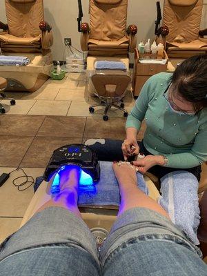 Finishing my pedicure with a gel polish