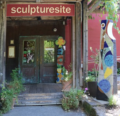 Our colorful outdoor sculptures are shown here in front of an antique copper door on one of the buildings at Jack London Village.