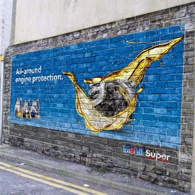 Outdoor advertising painted with The Wall Printer on brick