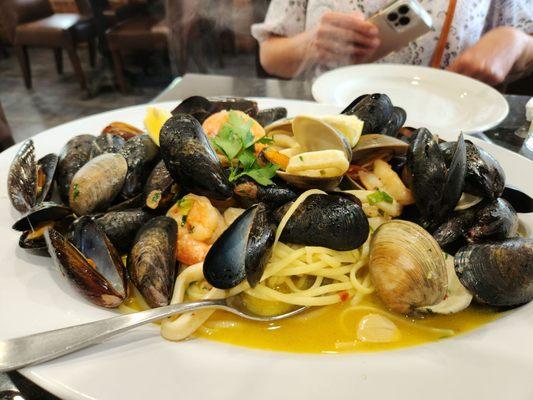 Pescatore in white wine over linguine! Yummy!