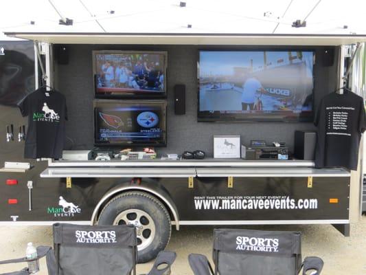 Mobile Man Cave Tailgating Trailer with 3 tv's, sound system, keg taps and even a private bathroom.