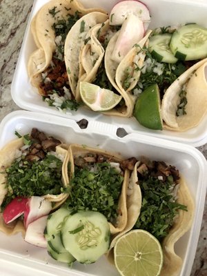 Tacos carnitas ($9) and tacos al pastor ($9)