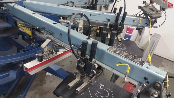 One of our presses in action, this baby can print up to 700 shirts per hour!