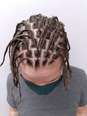 Fresh set of locs. This client started her locs a little under a month ago.