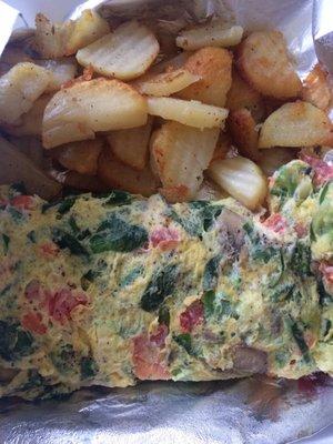 Veggie omelet and home fries, yum!