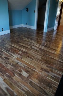 Upstairs floor install by Woodcraft. Natural pre-finished acacia.