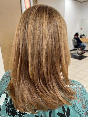 Full hair color with partial highlights and long layer haircut