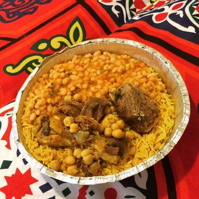 Yellow rice, white beans (fasolia beydha), butter soft fall off the bone chicken, & equally butter soft beef stew w. chick peas.