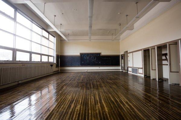 Former classrooms and coworking desks available for lease to host offices, youth programs, and events.