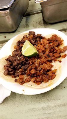 Tacos de Asada and Tacos de Al Pastor. ..I like my tacos without veggies sometimes.