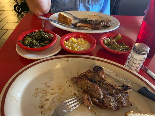 Our meal, partially eaten- grilled pork chops, turnips, corn and green beans.