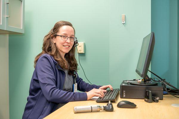 Dr. Yoder performing a hearing test