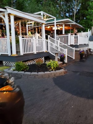 Outdoor Patio with lights is busy on a Friday night at 8pm, but Humid though  6/2/2023