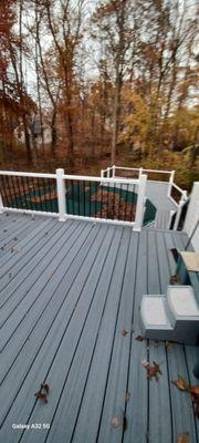 New Trex decking installed on upper and lower pool deck. And new contemporary railings.